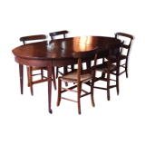 Solid oak table with 3 extension cords, 6 oak chairs with straw seat