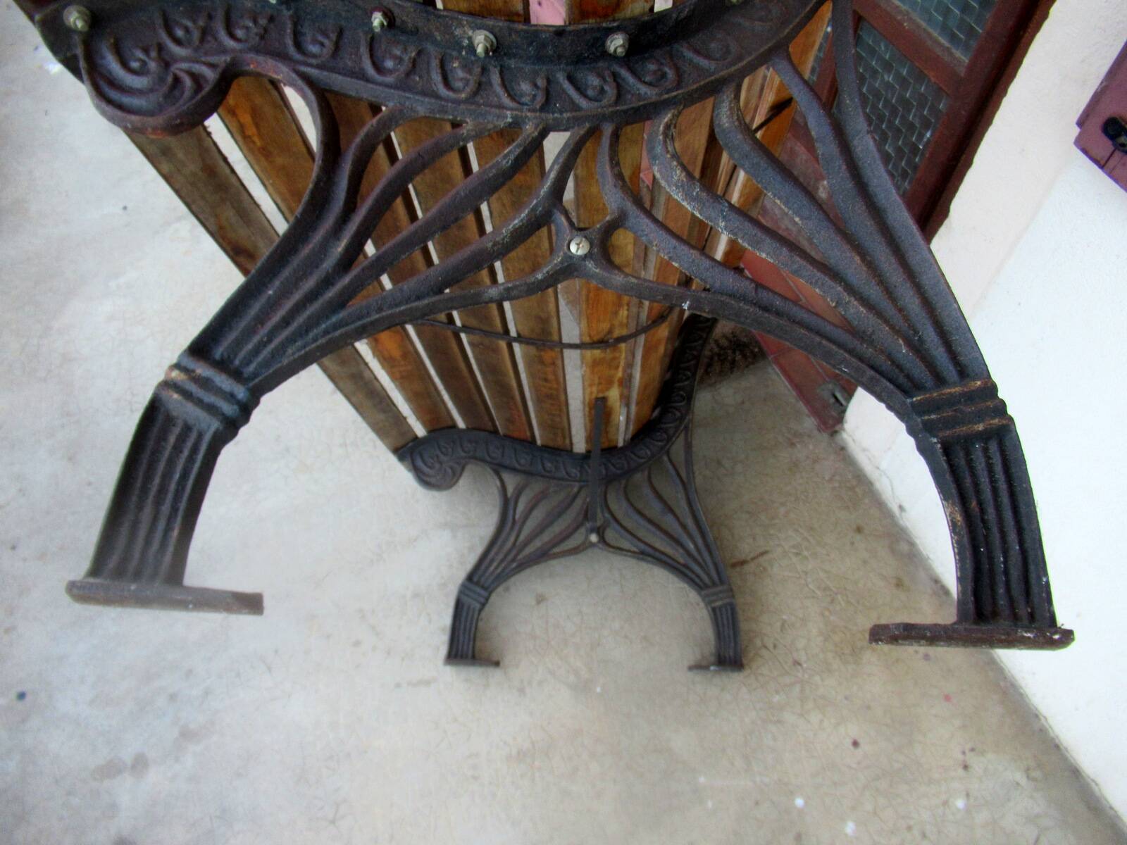 Small garden bench, with cast iron legs.
