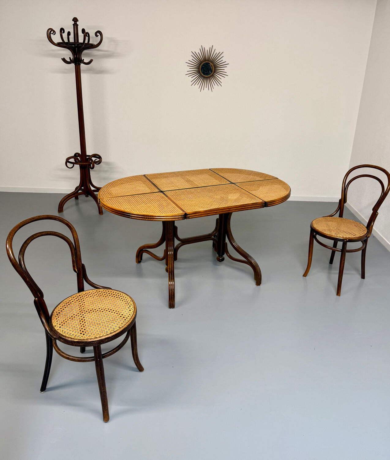 Vintage dining table with a cane top by Mundus from the 1970s.