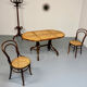 Vintage dining table with a cane top by Mundus from the 1970s.