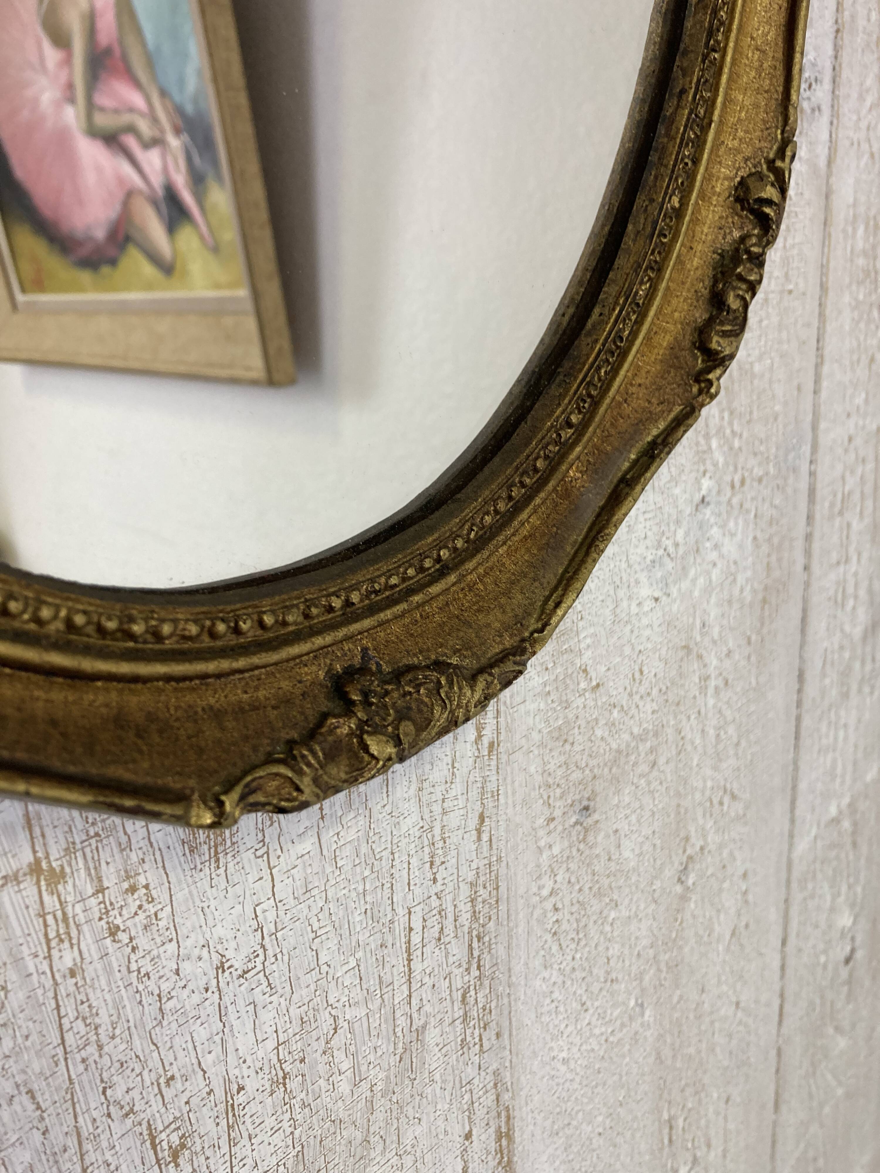 Antique oval mirror