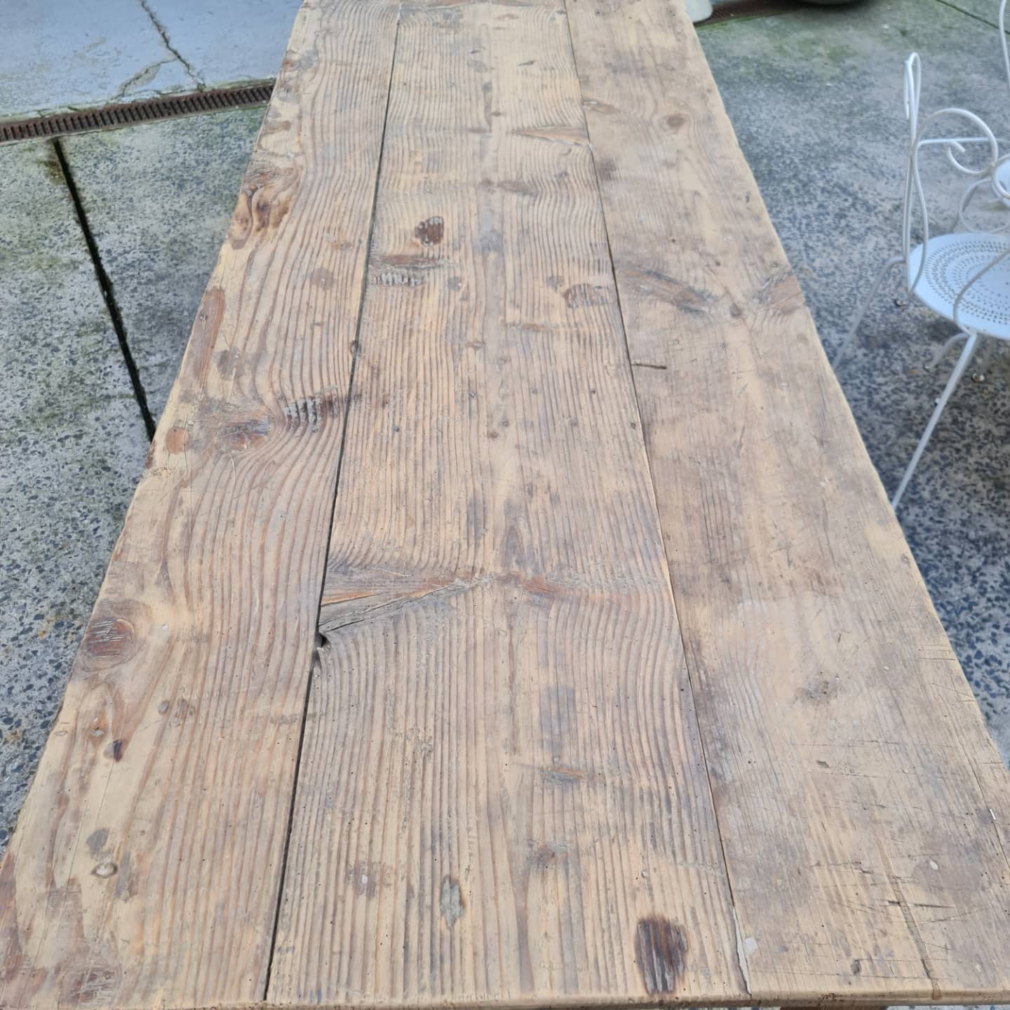 Large antique farmhouse table with a drawer