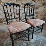 Pair of antique Napoleon III chairs in blackened wood and fabric