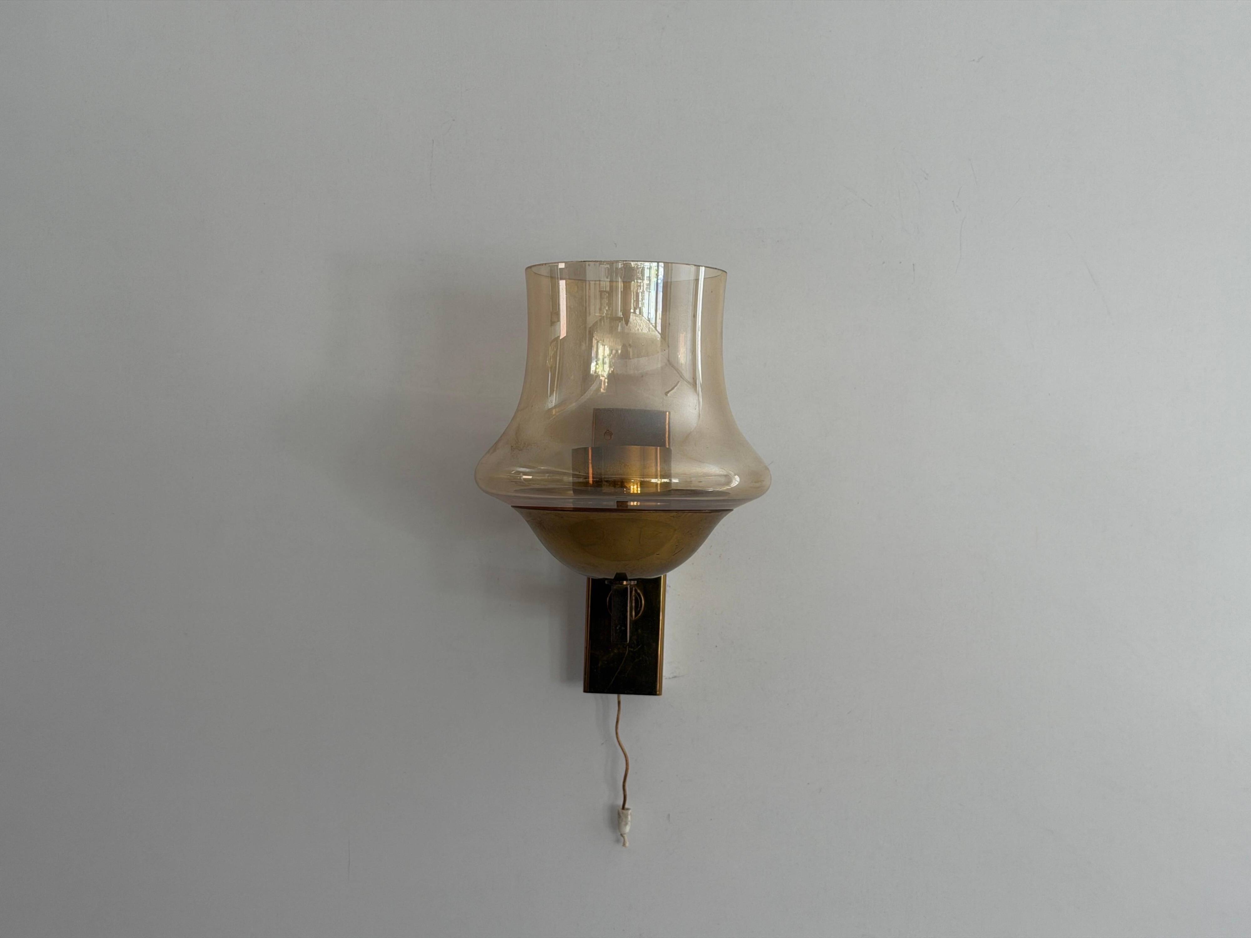 Yellow glass and brass wall light from the mid-century, 1960, Germany.