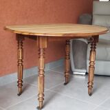 Old round table in walnut with flaps Louis Philippe
