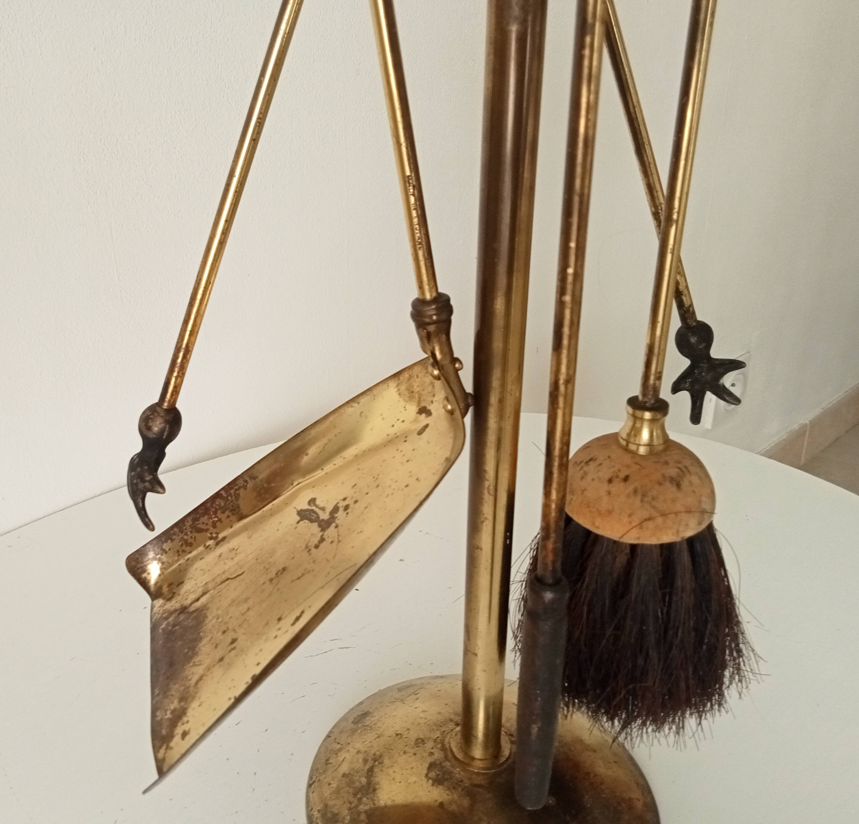 Old brass fireplace servant