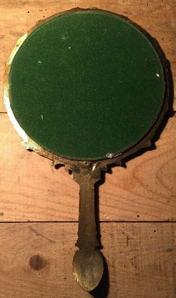 Antique mirror facing round hand in bronze 23cm