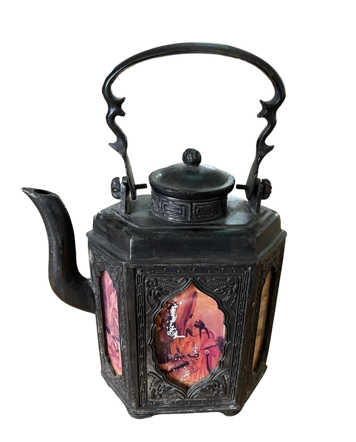 Ancient Asian teapot made of pewter and glass