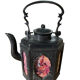 Ancient Asian teapot made of pewter and glass