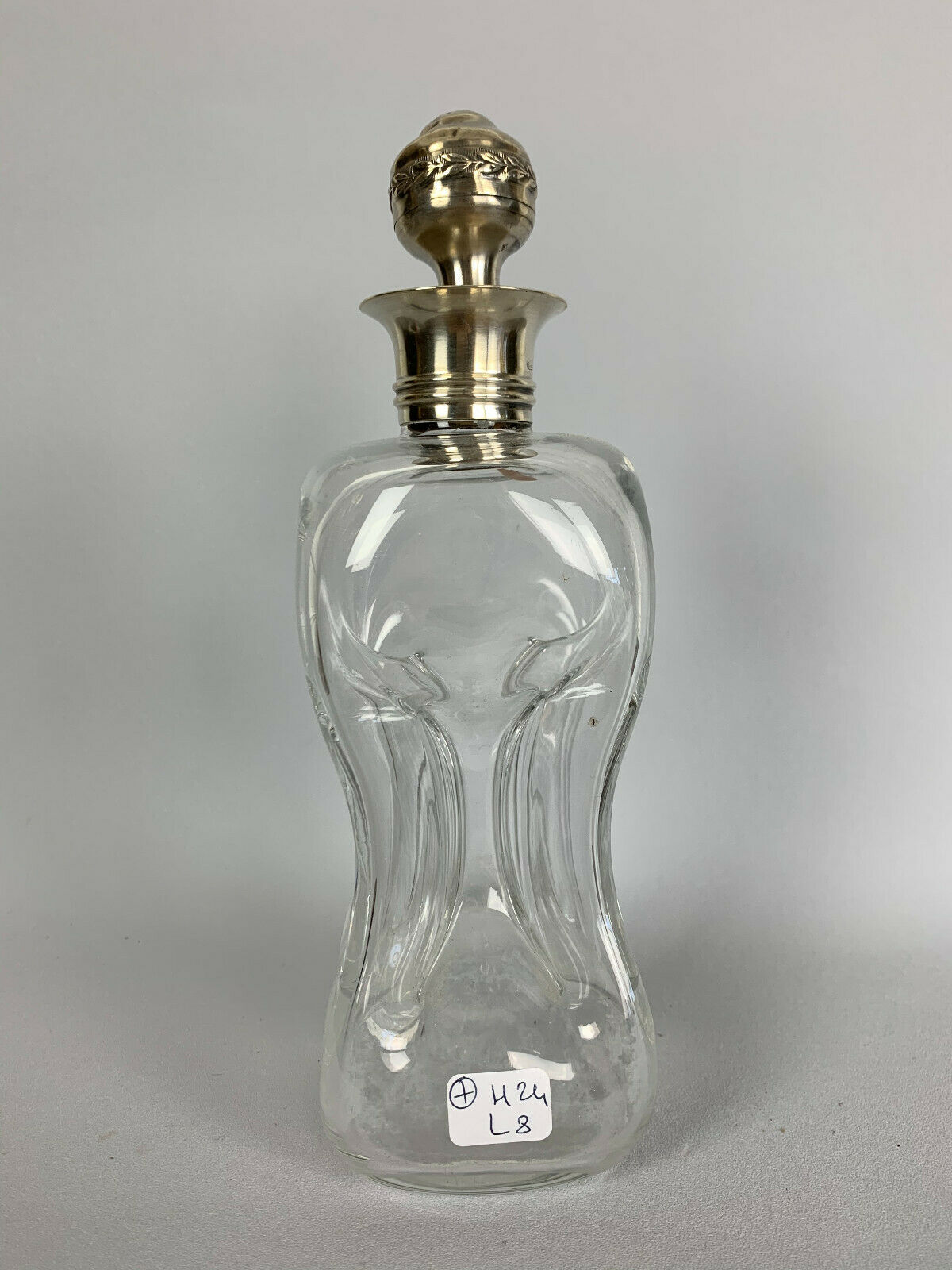 Blown glass carafe with silver frame and cap