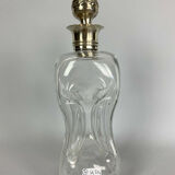 Blown glass carafe with silver frame and cap