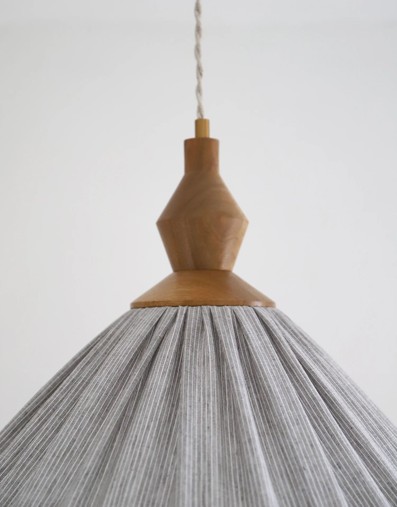 Pleated curtain Olga in linen and cotton with fine classic grey stripes.