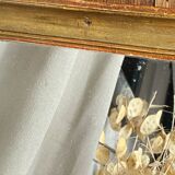 Antique mirror in gilded wood