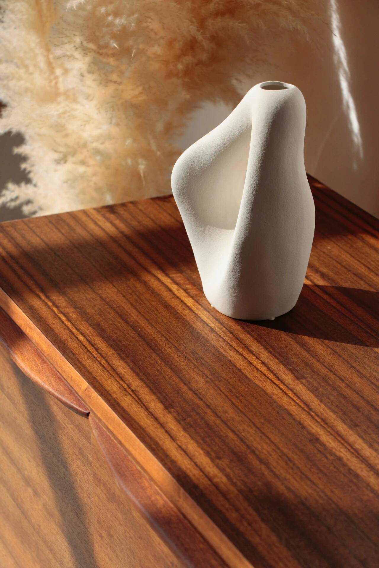 Vintage zebrano and walnut furniture from Morris of Glasgow.