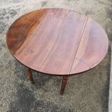 Table ronde à volets noyer