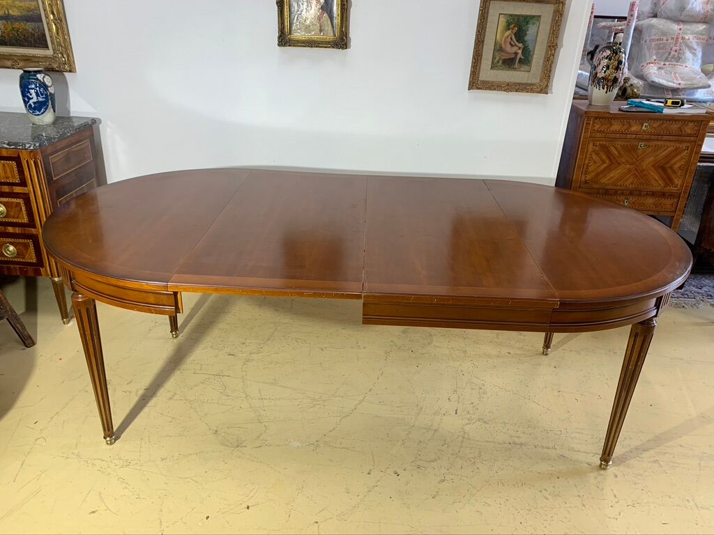 Louis XVl style round table in cherry with extensions