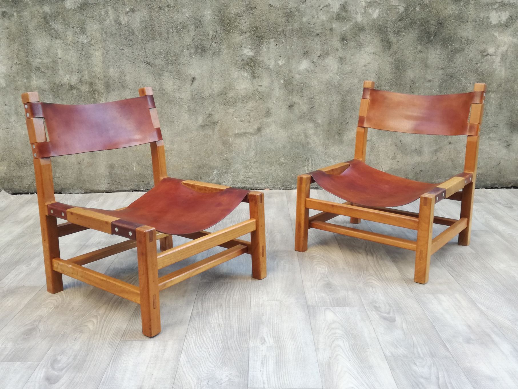 Pair of elm and leather heaters by Maison Regain, 1960s