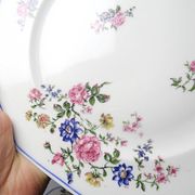 4 flat plates by Bernardaud, Limoges porcelain, floral decoration from the 1920s to 1950s.