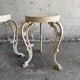 Pair of cream-white cast iron side tables with wooden tops — neoclassical shabby-chic