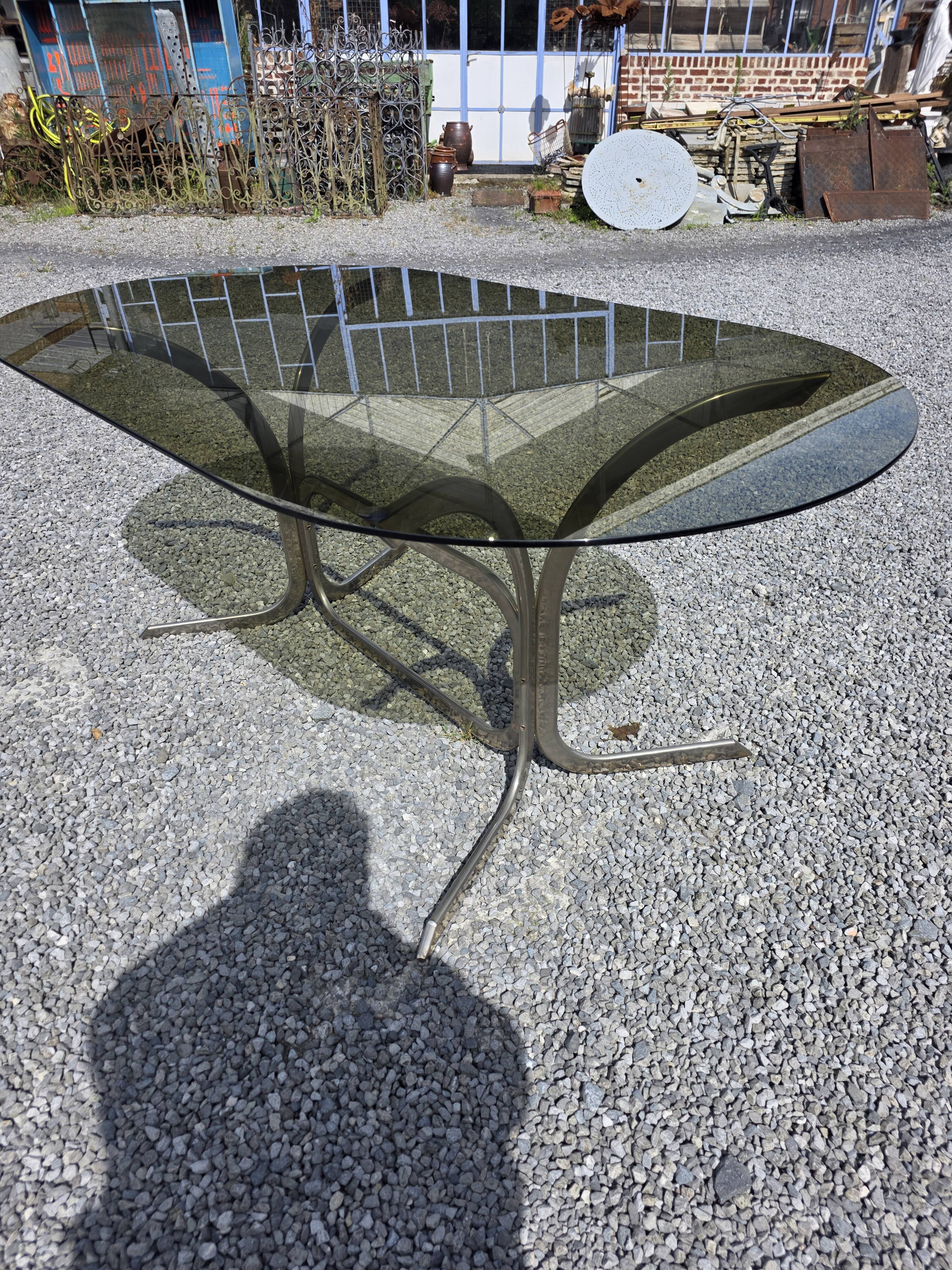 Silver metal table with smoked glass top from the 1970s.