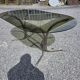 Silver metal table with smoked glass top from the 1970s.
