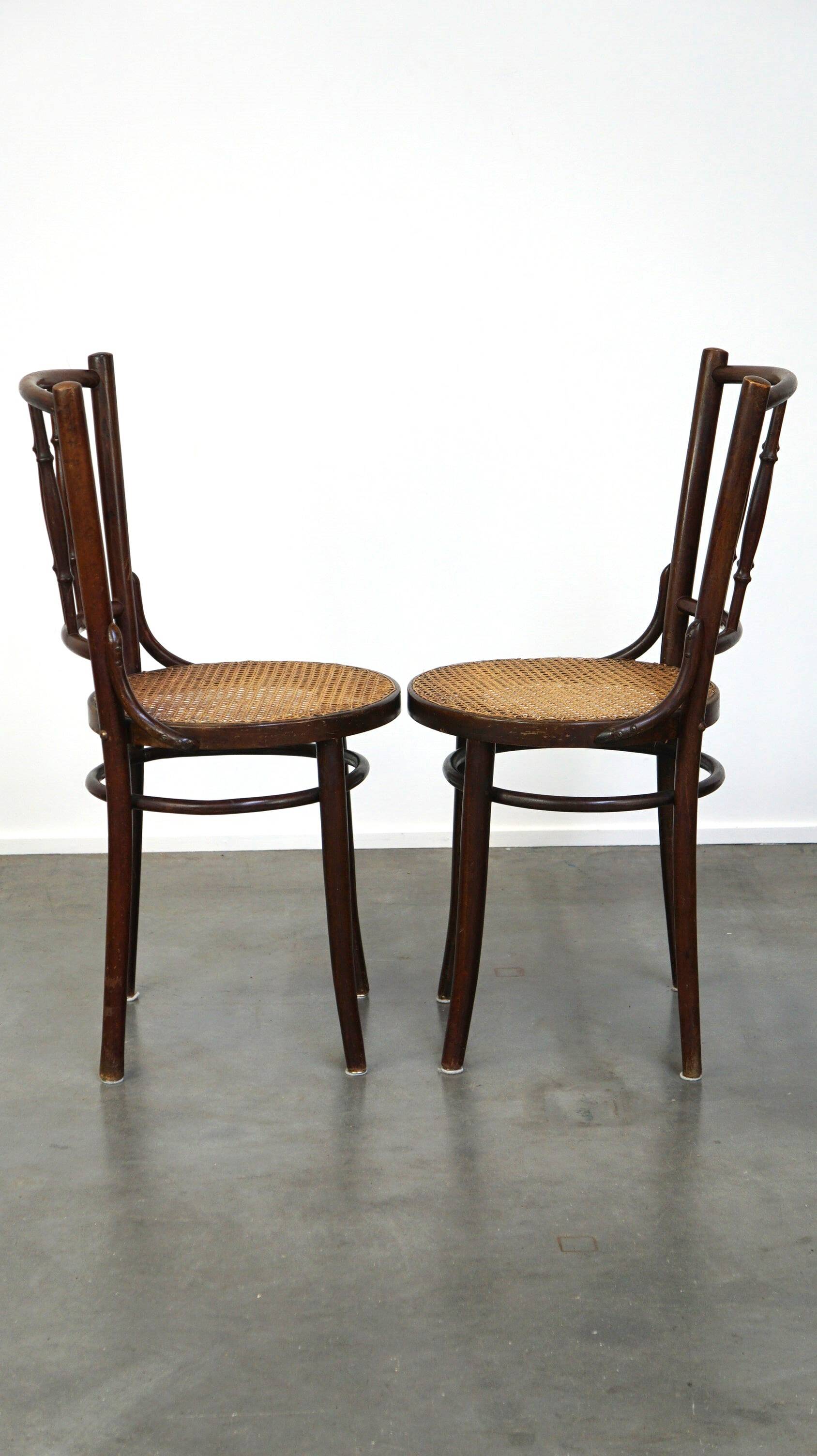 4 antique wooden and cane bistro chairs