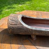 Lot of sandstone planter in the shape of logs