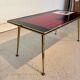 Vintage 70s coffee table – red & black graphic top – laito