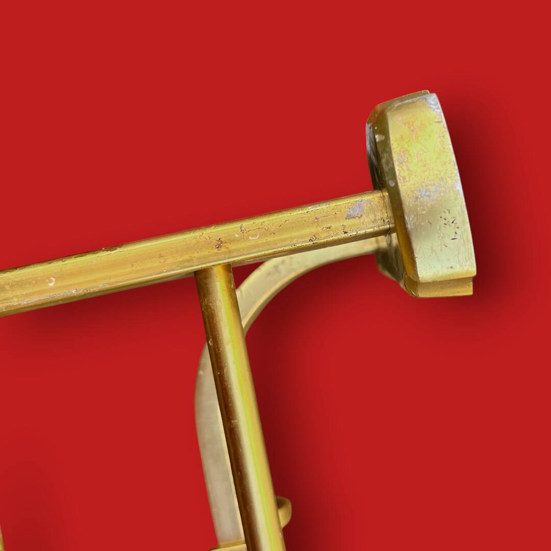 Vintage wall-mounted coat rack in anodised gold aluminium with hat holder.