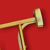 Vintage wall-mounted coat rack in anodised gold aluminium with hat holder.