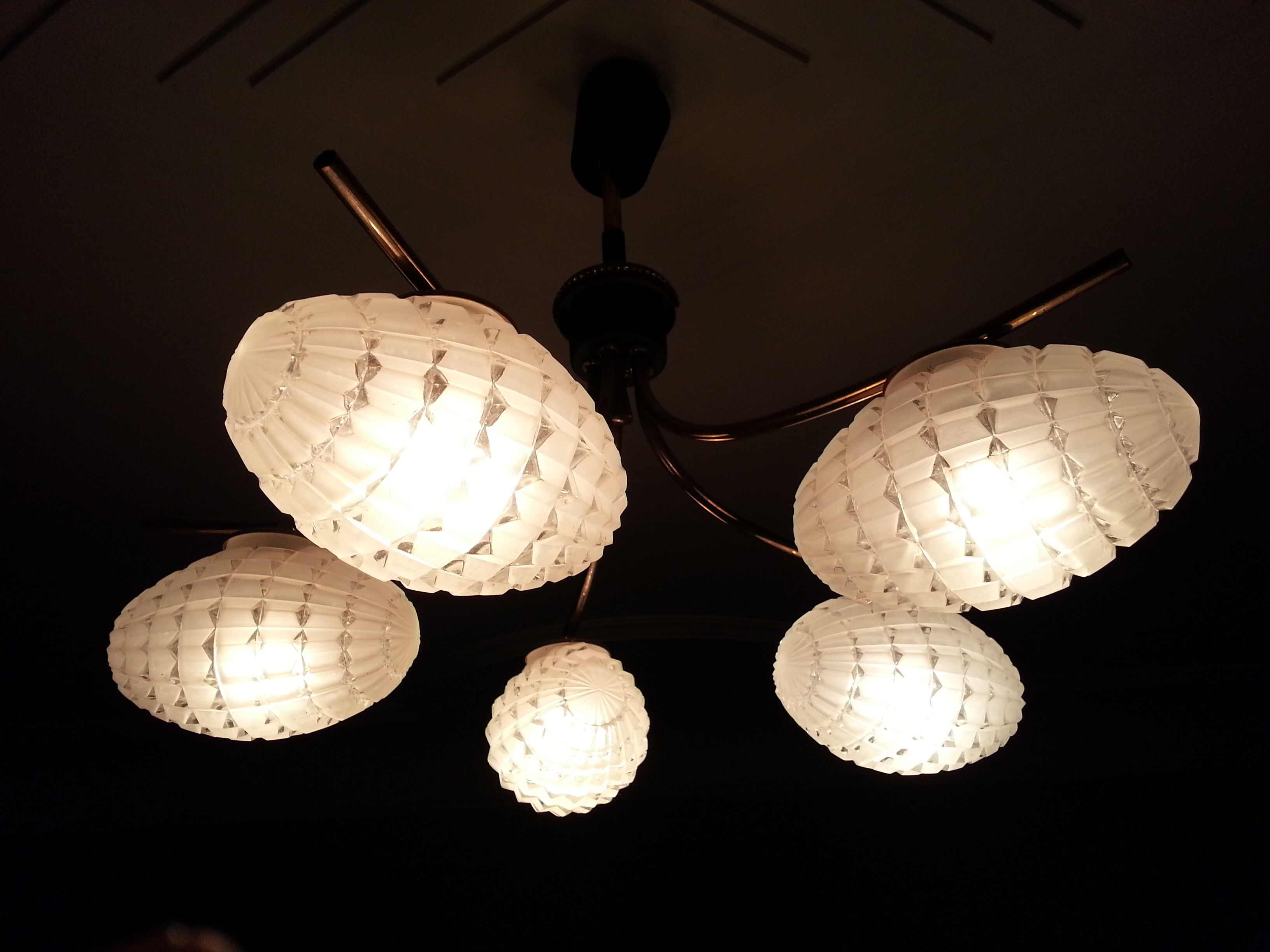 Cosmic brass and chiseled glass chandelier