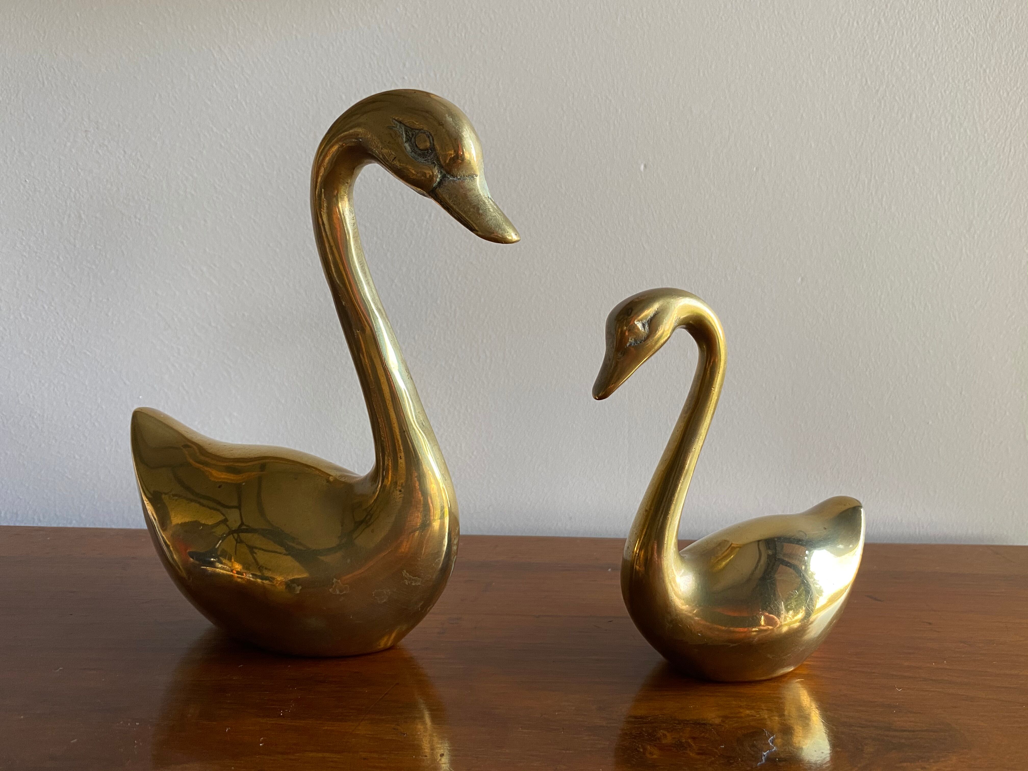 Duo of ancient brass swans