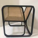 Armchair in black lacquered rattan and natural cane