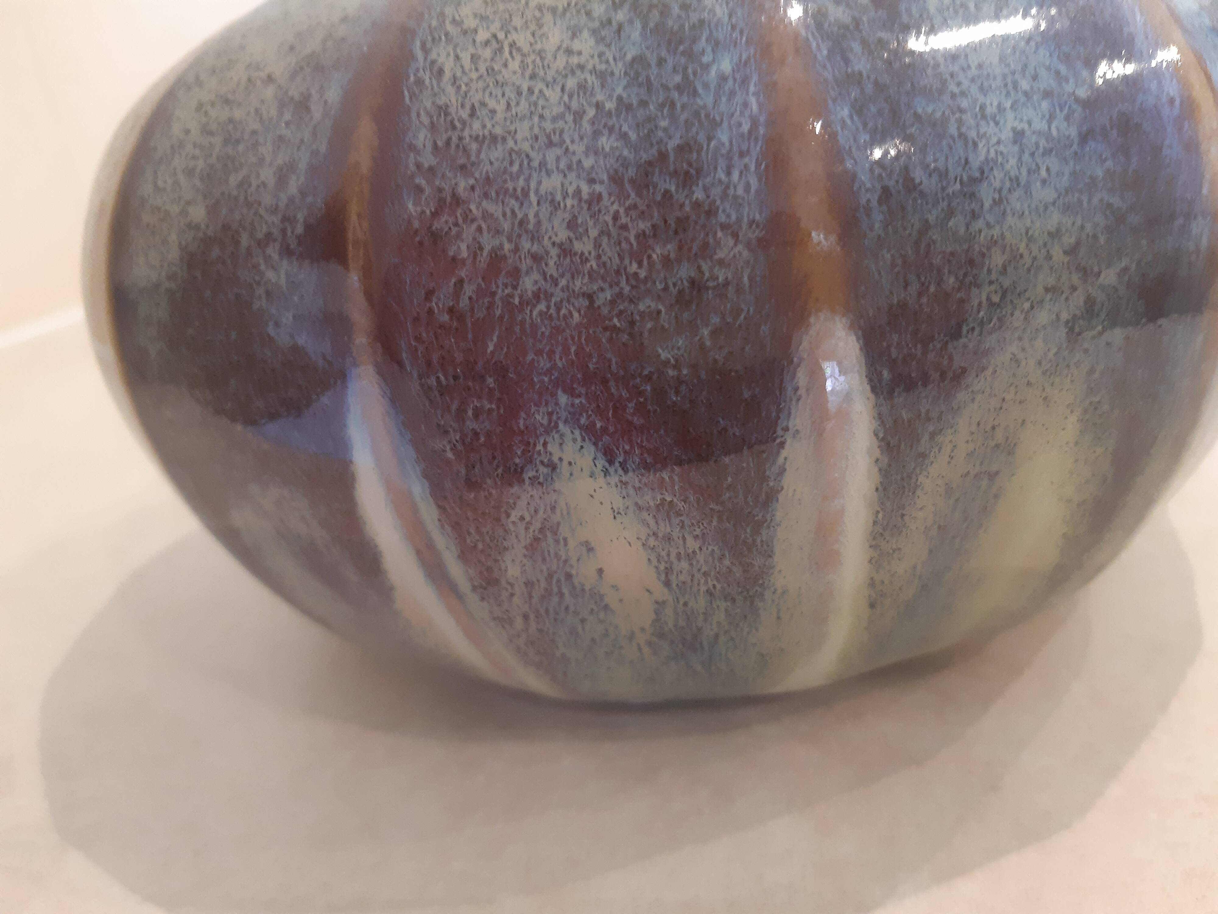 Globe vase, narrow neck, wide body.