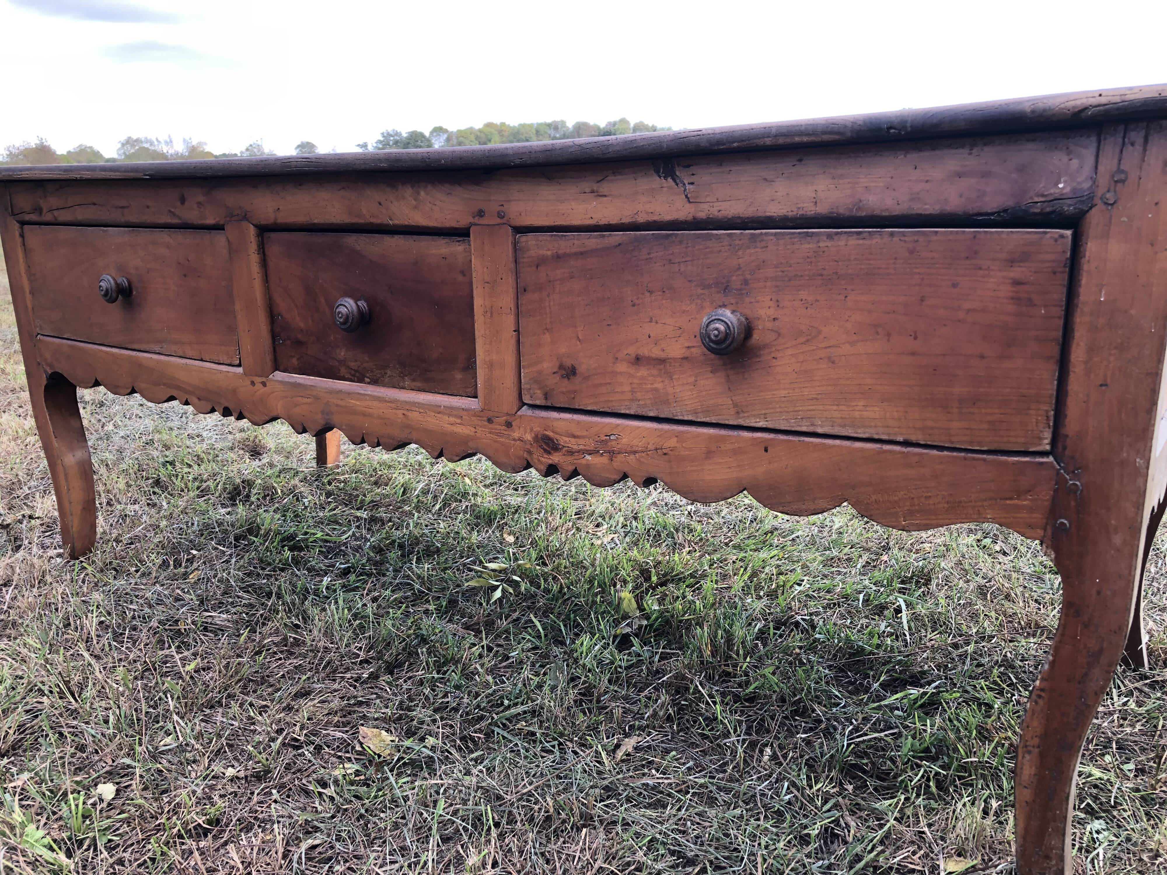 Antique Louis XV paneled table with 3 front drawers in solid cherry wood