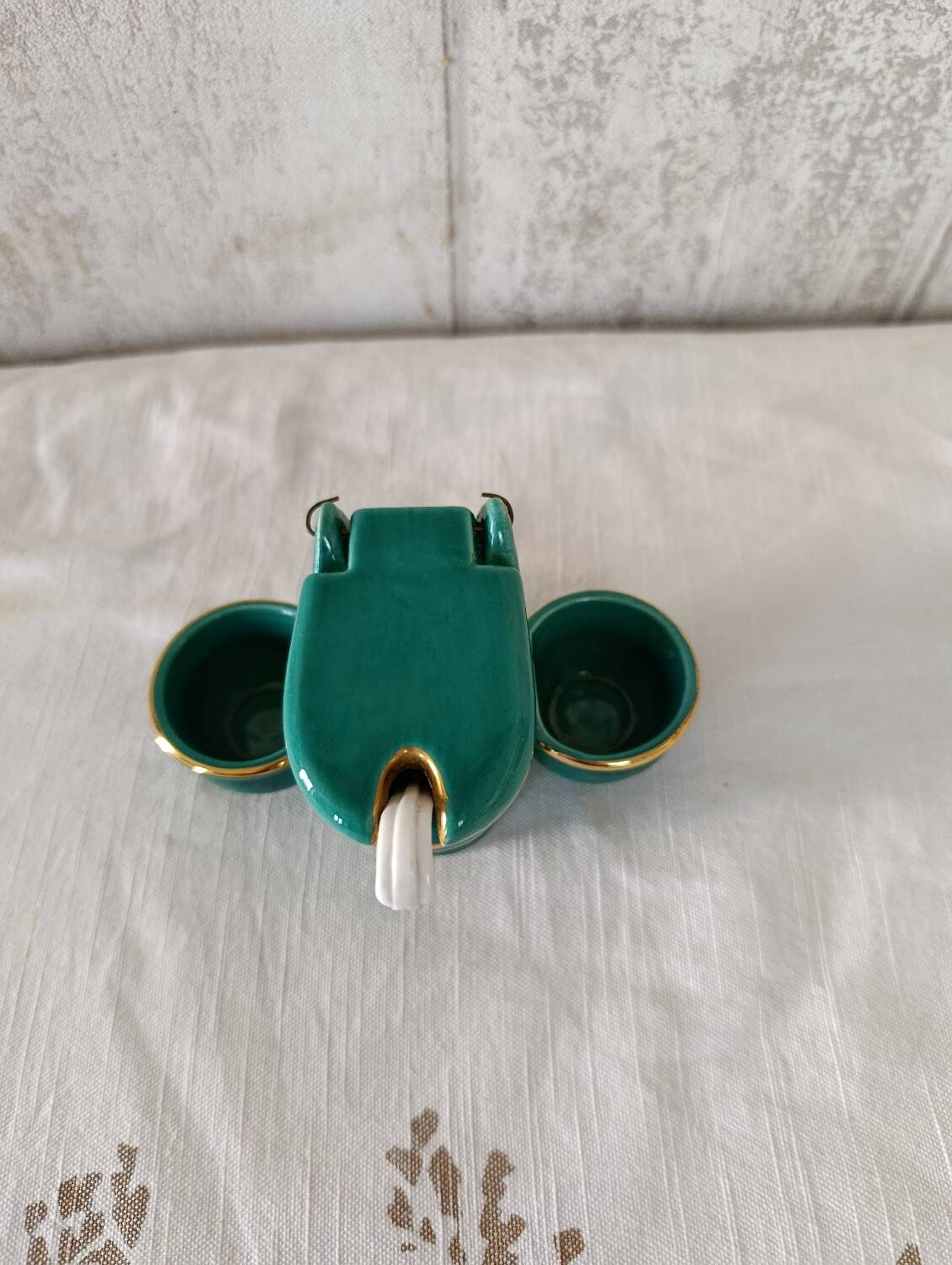 Mustard and salt pepper shaker in the shape of a toilet.