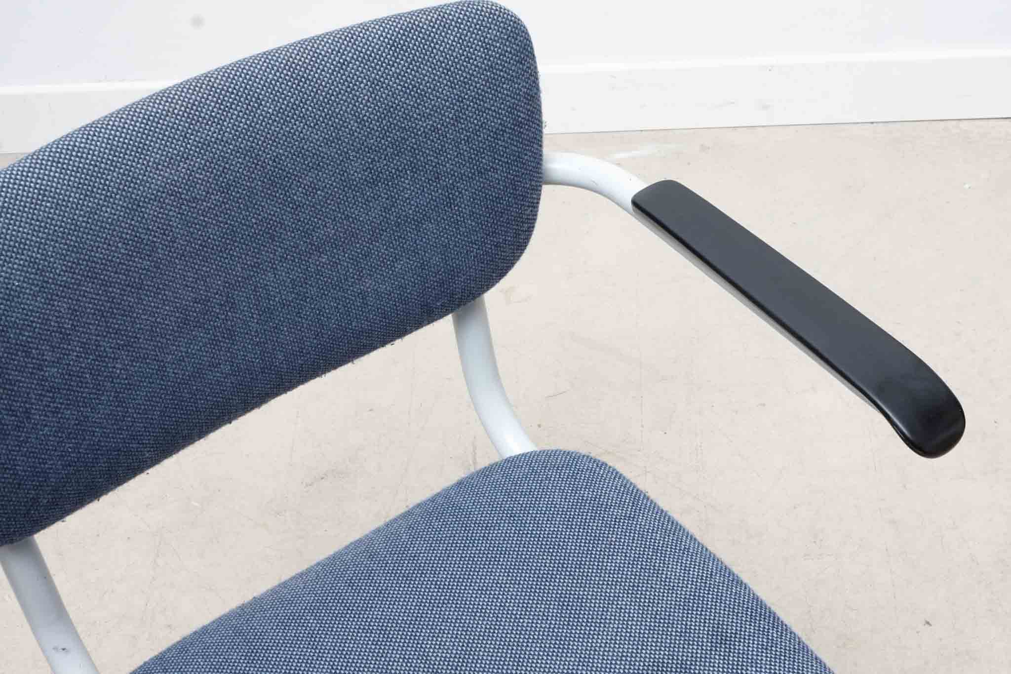 Blue fabric S-shaped chair with armrests