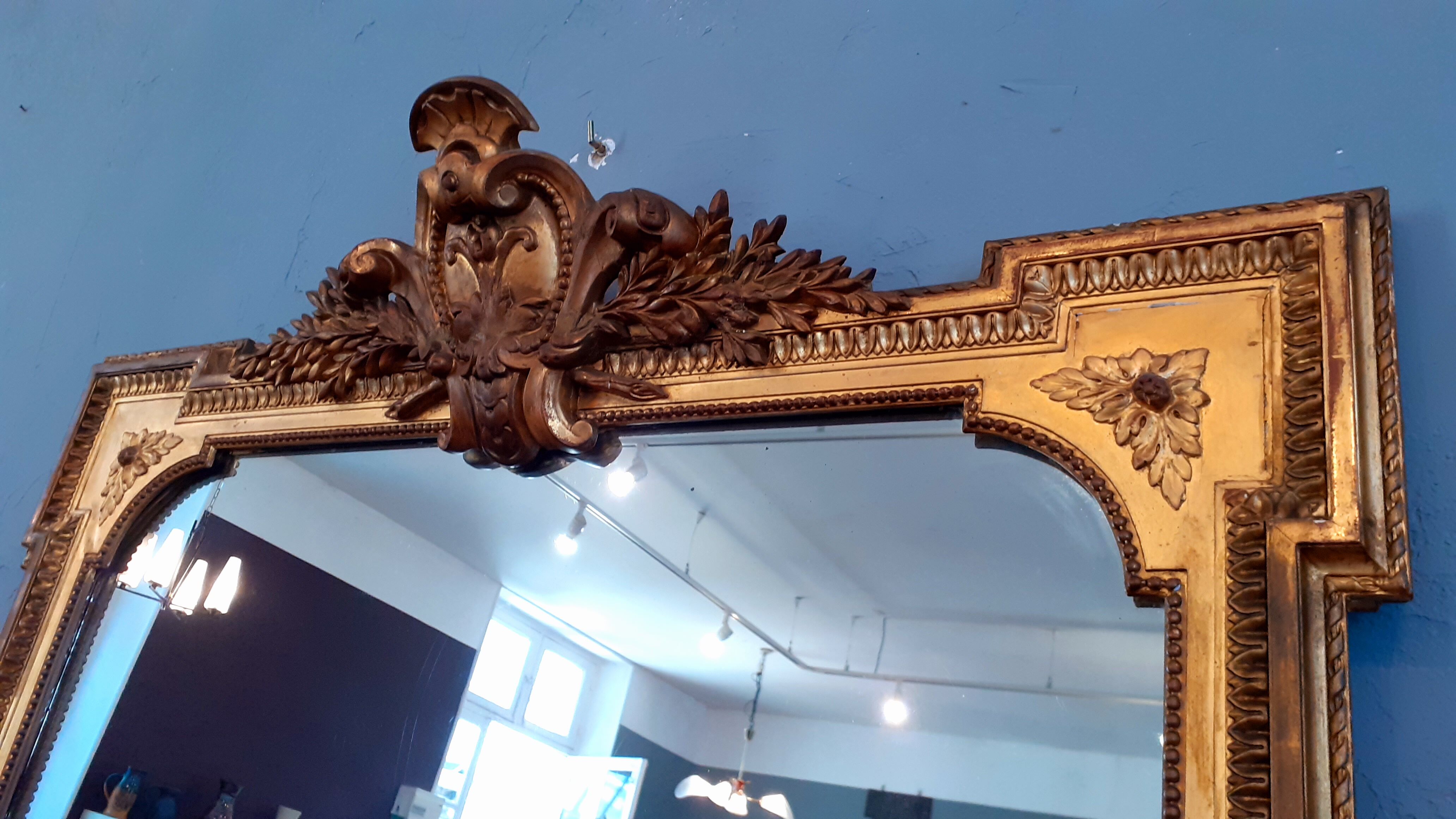 Large mirror XIX th in wood and gilded stucco Louis XVI style
