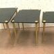Pull out tables in brass and black glass XX century
