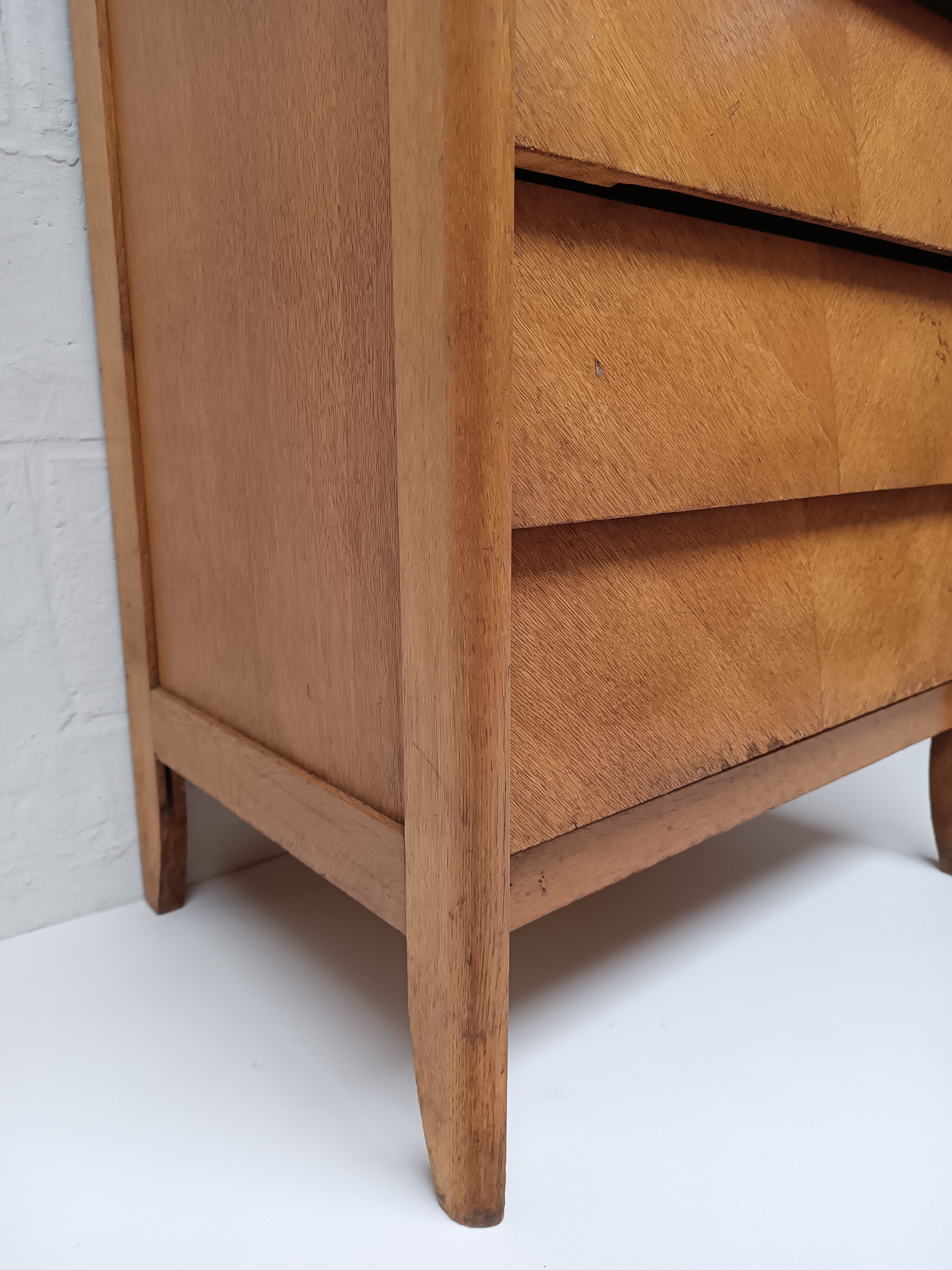 High wooden chest of drawers in the 50s