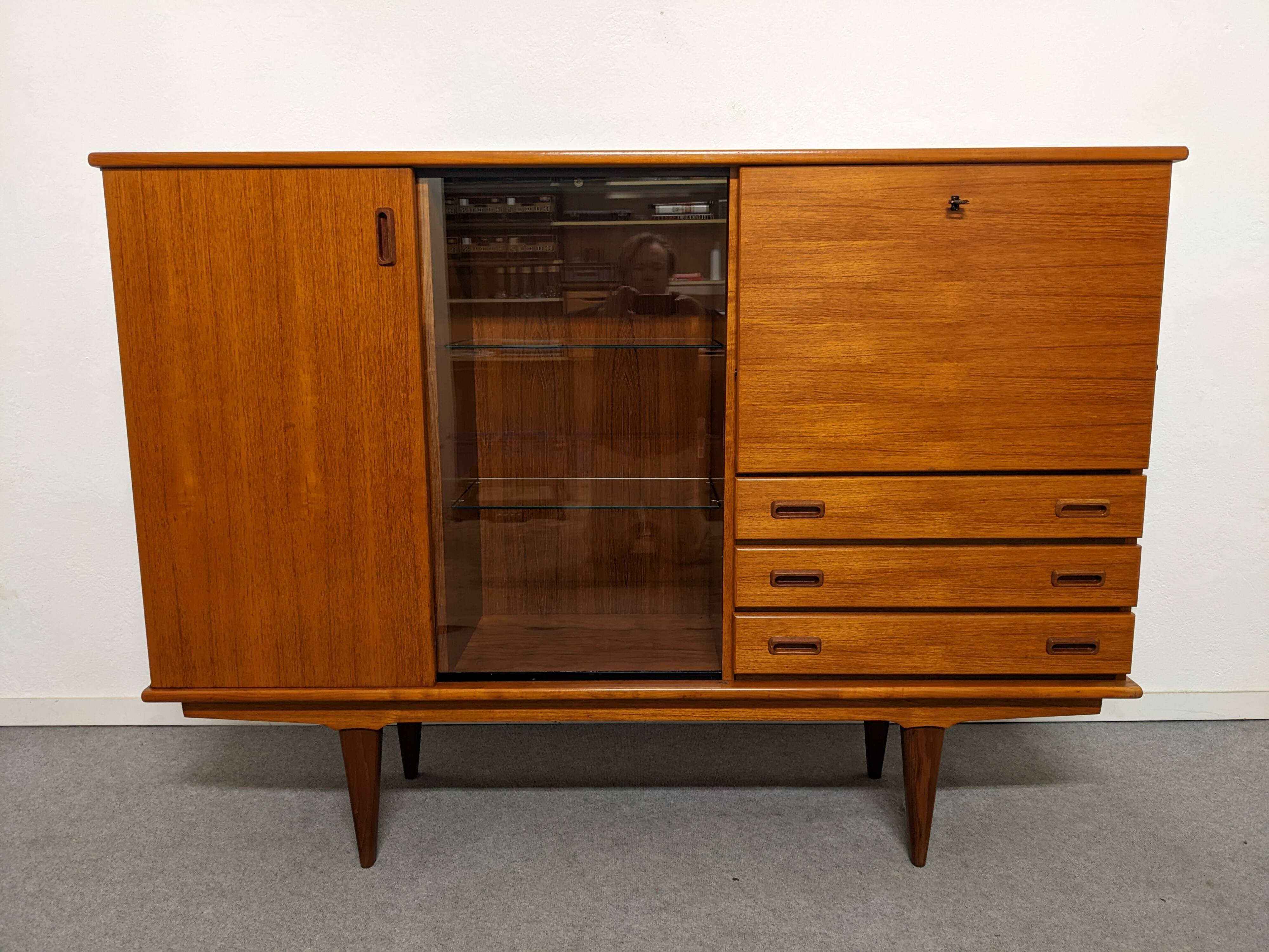 High sideboard, display cabinet and secretary, Scandinavian in teak, France around 1960.