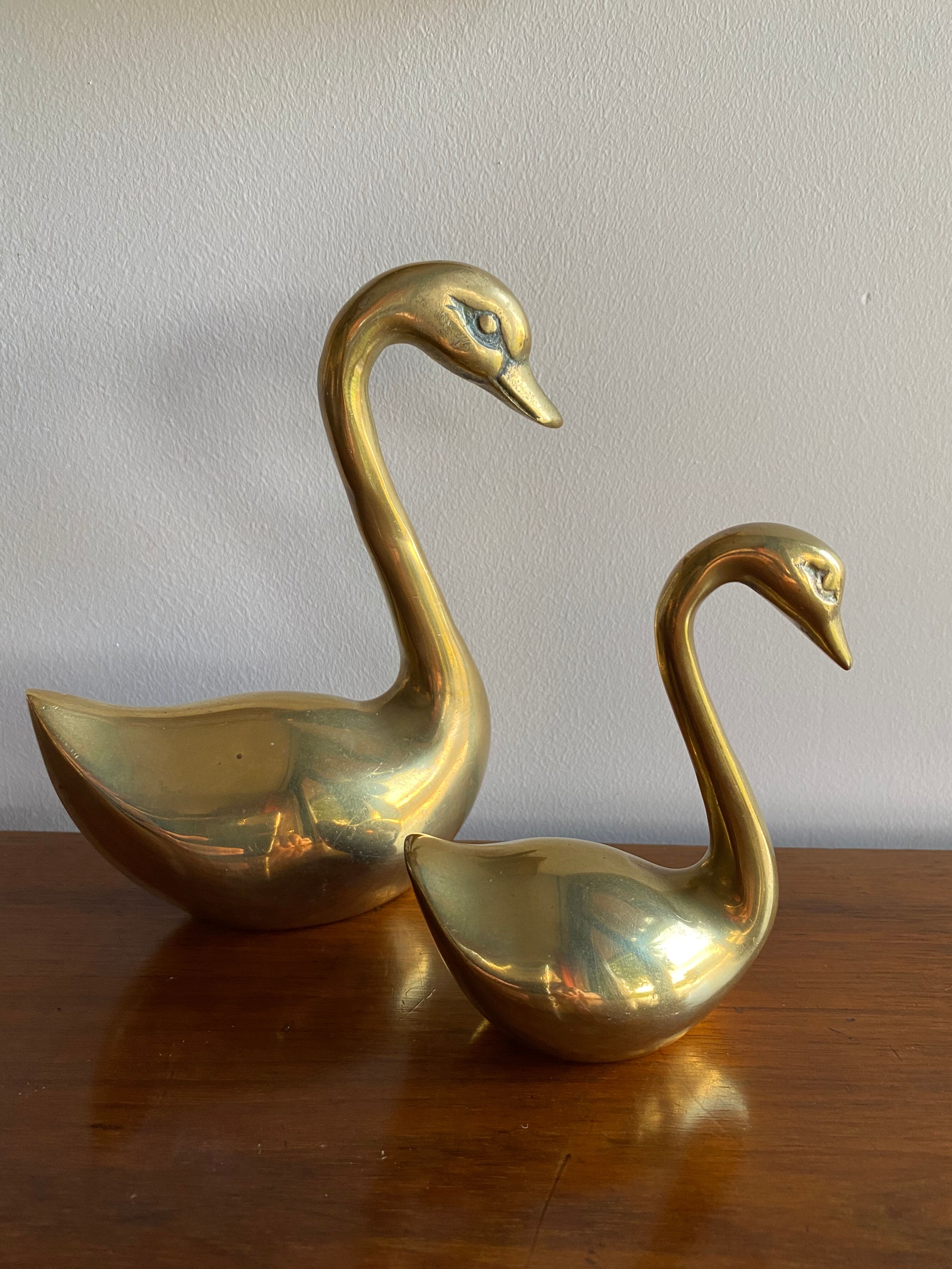 Duo of ancient brass swans