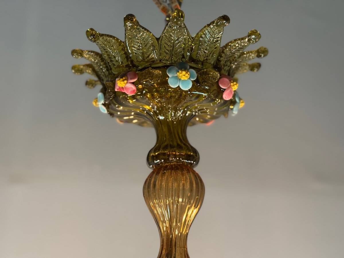 Venetian chandelier in multi-colored Murano glass with a green dominant color, 12 light arms, circa 1880