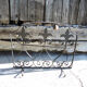 Old wrought iron fleur-de-lis fire screen