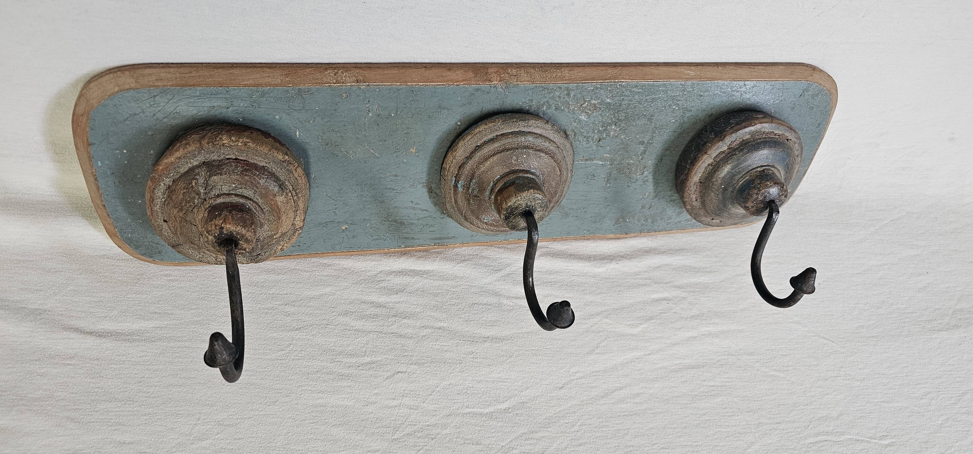 Antique teak coat rack with 3 wrought iron hooks