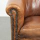 Vintage sheepskin club armchair in a subtle size with warm colours
