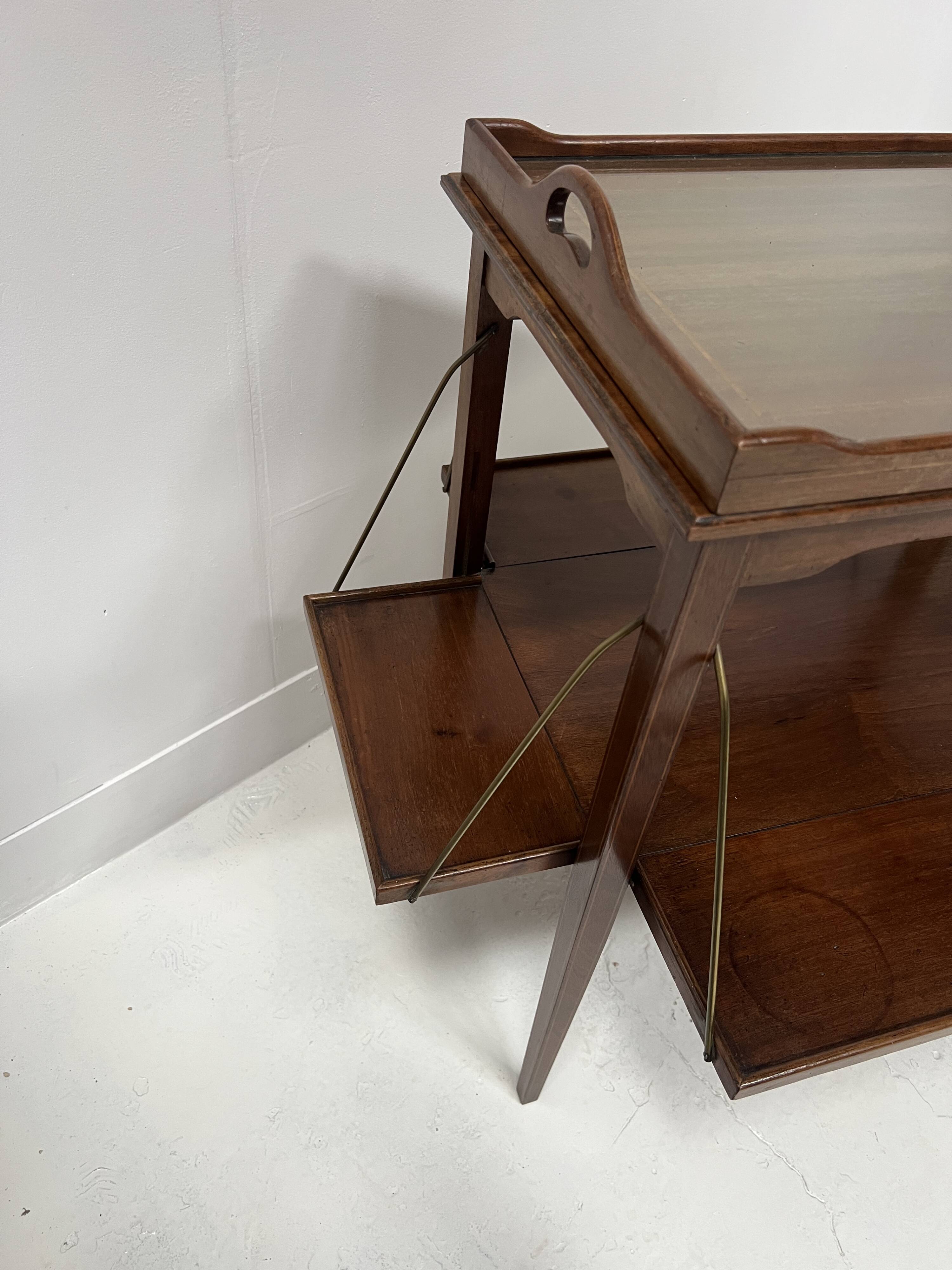 Mahogany serving table with marquetry inlay decoration, 20th century.