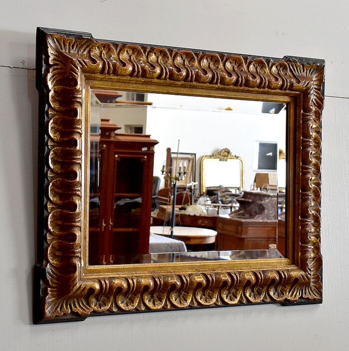 Gold-tinted wooden and stucco rectangular mirror - 1920