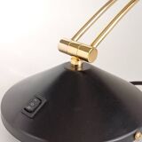 Articulated black and gold metal desk lamp