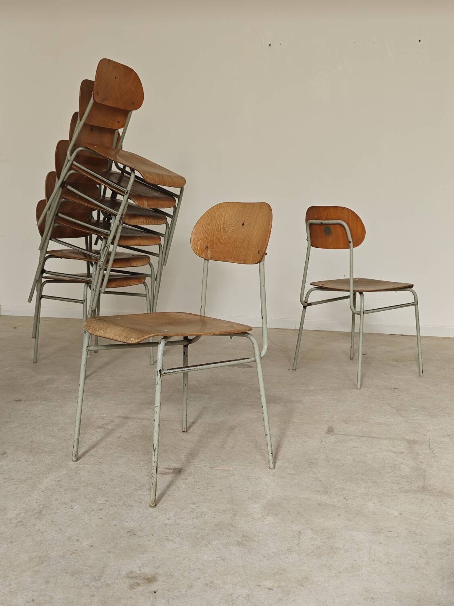 Set of 8 metal and wood school chairs  
Ex Czechoslovakia 1960
